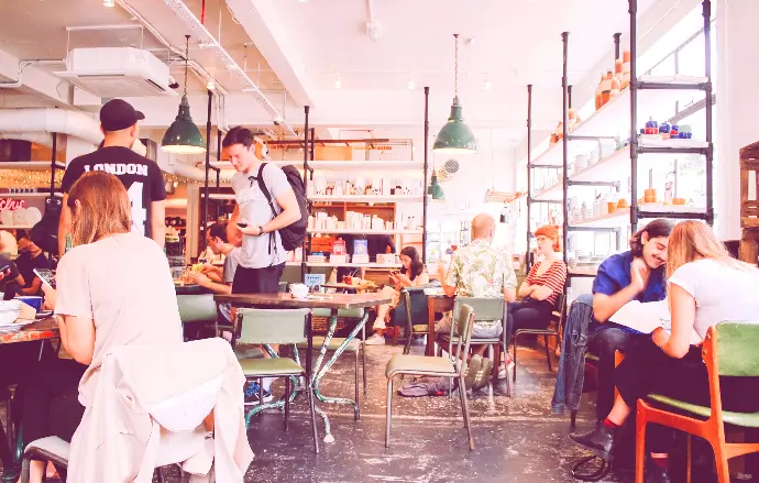 people eating inside of cafeteria during daytime